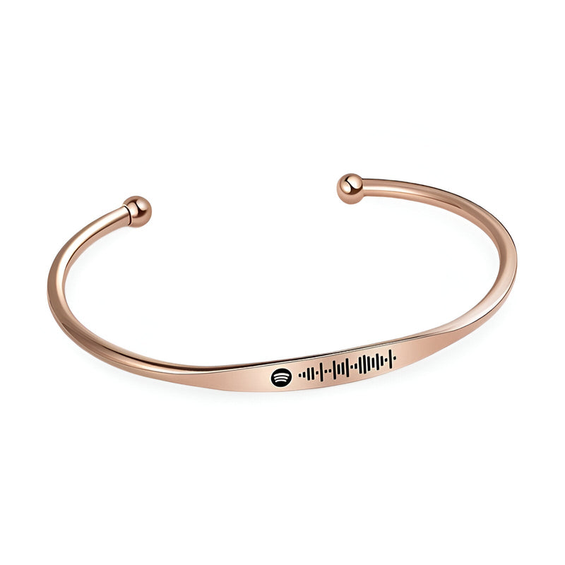 Bracelet jonc en acier inoxydable fin en or rosé avec gravure code Spotify noir central.