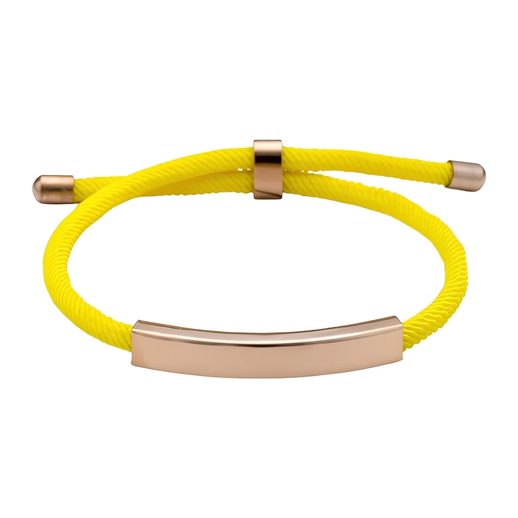 Bracelet cordon jaune en nylon avec barre lisse en acier inoxydable doré et fermoir coulissant.