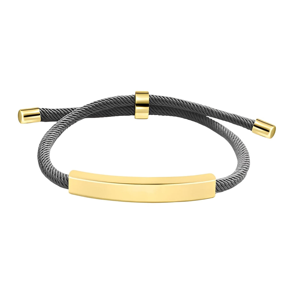 Bracelet cordon nylon gris avec barre et embouts en acier inoxydable doré, fermoir coulissant ajustable.