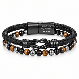 Packshot studio bracelet Alviron noir, double rang posé de face sur fond blanc — gravure Love you / My Brother / ♥ ♥ ♥ restaurée 8 octobre 2026