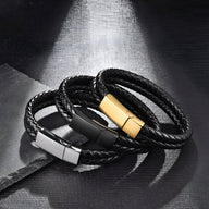 Bracelet double tour en cuir noir tressé avec fermoir métallique rectangulaire doré, argenté et noir mat.