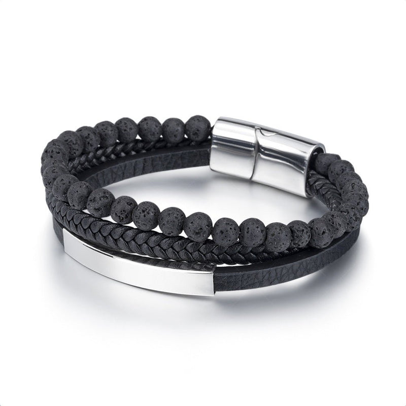 Bracelet homme avec perles noires volcaniques, cuir tressé noir et fermoir magnétique argenté.
