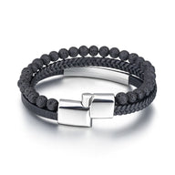 Bracelet homme double tour en cuir noir avec perles volcaniques noires et fermoir argenté mat.