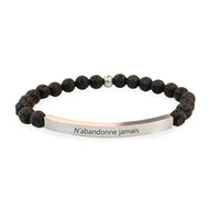 Bracelet mixte en pierres volcaniques noires avec barre métal gravée "N'abandonne jamais".