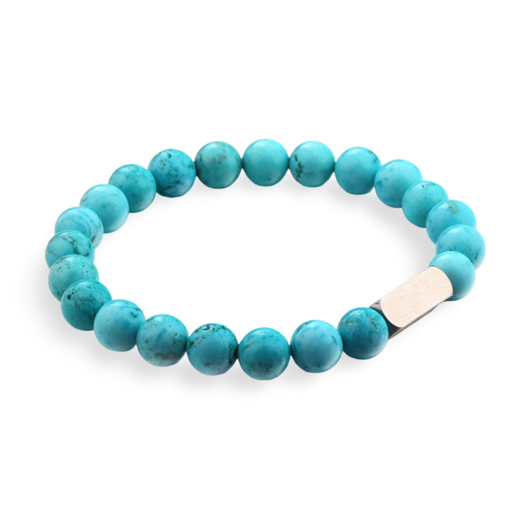 Bracelet mixte en pierres naturelles de turquoise bleue avec fermoir métallique argenté.