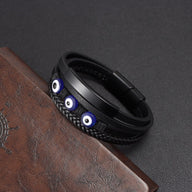 Bracelet homme cuir noir multi-rangs avec œil protecteur bleu et fermoir magnétique style moderne.