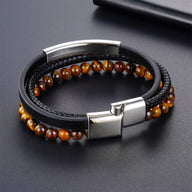 Bracelet homme en cuir noir tressé avec perles naturelles œil de tigre marron et fermoir magnétique acier inoxydable élégant.