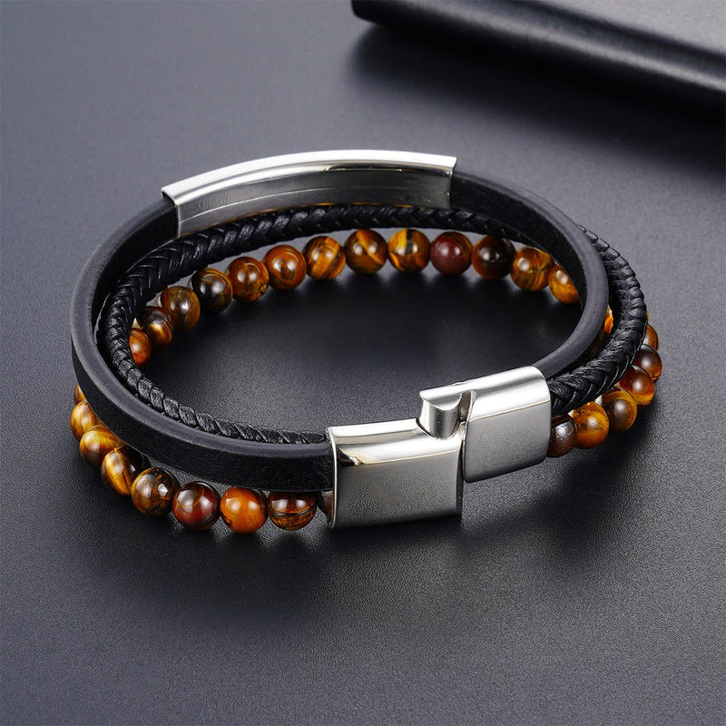 Bracelet homme en cuir noir tressé avec perles naturelles œil de tigre marron et fermoir magnétique acier inoxydable élégant.