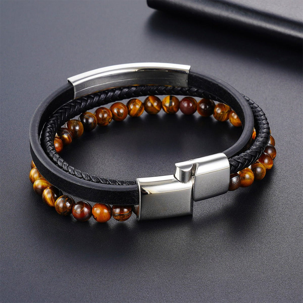 Bracelet homme en cuir noir tressé avec perles naturelles œil de tigre marron et fermoir magnétique acier inoxydable élégant.
