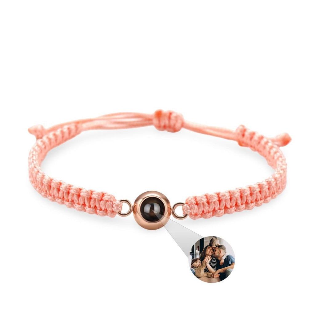Bracelet corde rose saumon avec perle titane noire et photo personnalisée ronde.