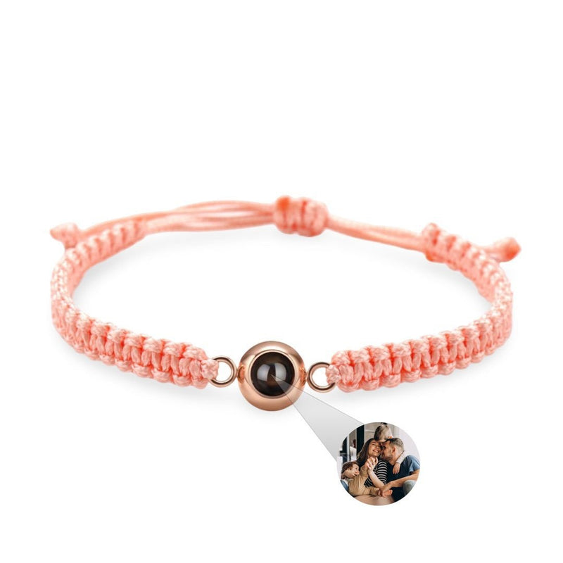Bracelet corde rose saumon avec perle titane noire et photo personnalisée ronde.