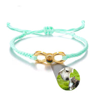 Bracelet corde turquoise avec signe infini doré et photo personnalisée d’un chien et d’un chat.
