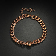 Bracelet maille cubaine en acier inoxydable couleur or rose avec fermoir boule réglable.