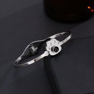 Bracelet en titane argenté avec pendentif patte d'animal et photo personnalisée ronde noire.