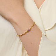 Bracelet fin en titane doré avec pierre de naissance violette tendance modèle Jumy.