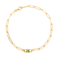 Bracelet fin en titane doré avec chaîne maillons rectangulaires et pierre carrée verte au centre.