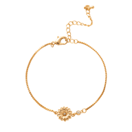 Bracelet fin en titane doré avec fleur sculptée centrale, style moderne et délicat.