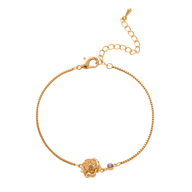 Bracelet fin en titane doré avec fleur délicate et pierre de naissance rose pâle.