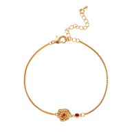 Bracelet fin en titane doré avec fleur et petite pierre rouge, style moderne Kinou.