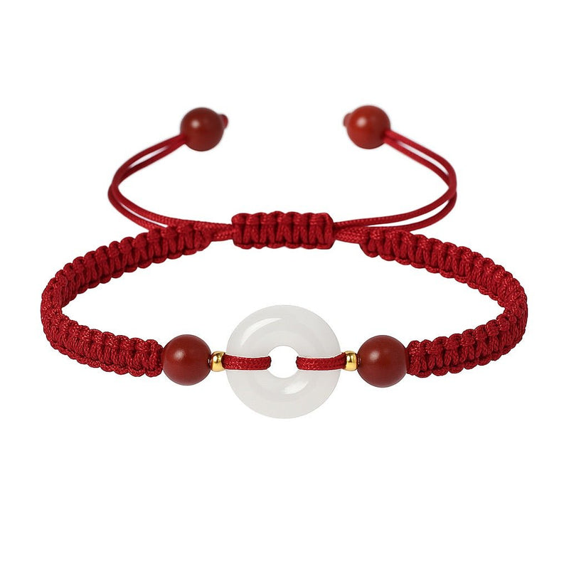 Bracelet rouge en fil ciré tressé avec pierre de jade blanche ronde et pierres de cinabre bordeaux.