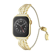 Bracelet or pour Apple Watch avec ailes d'ange scintillantes en acier inoxydable, finition dorée, style élégant et ajustable.