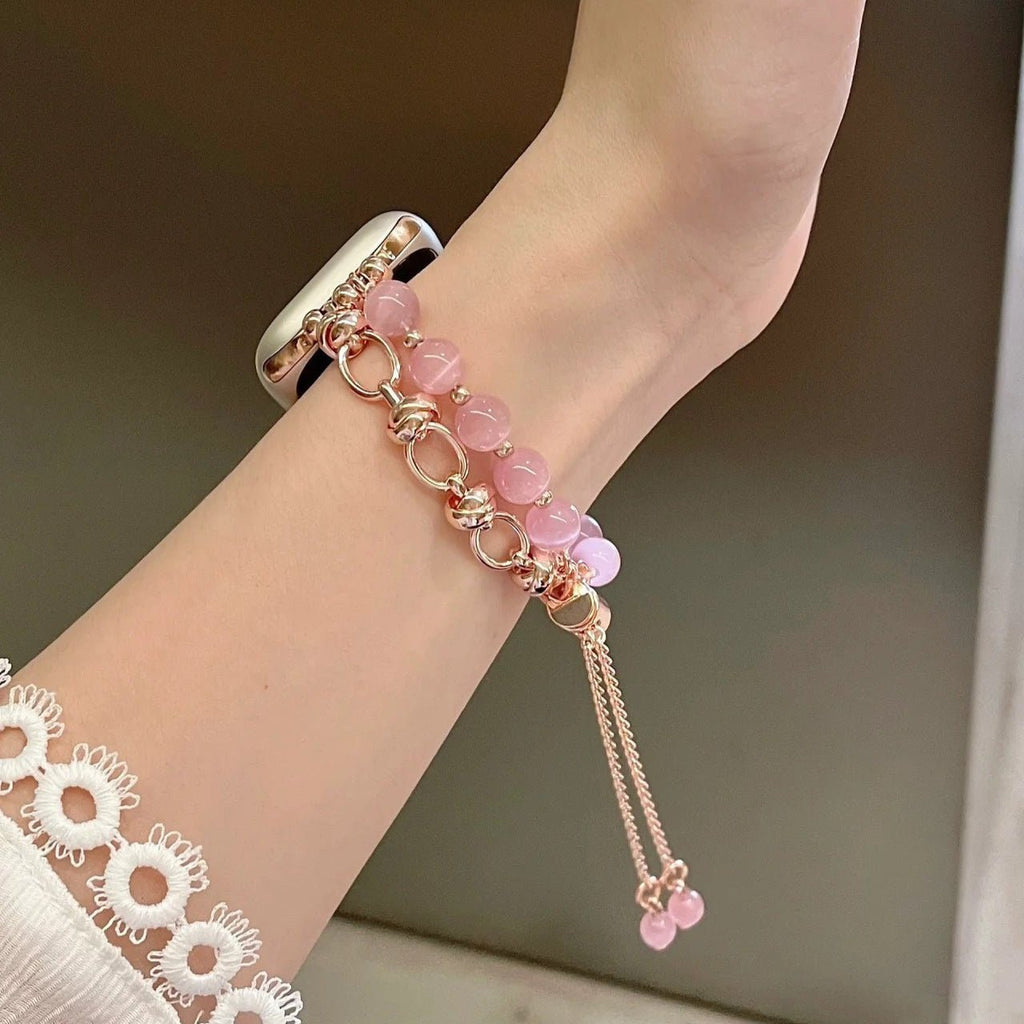 Bracelet pour Apple Watch en perles rose œil de chat et chaînes or rosé ajustable.
