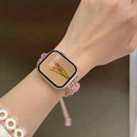 Bracelet pour Apple Watch en perles œil de chat roses et or rosé, style élégant et ajustable.