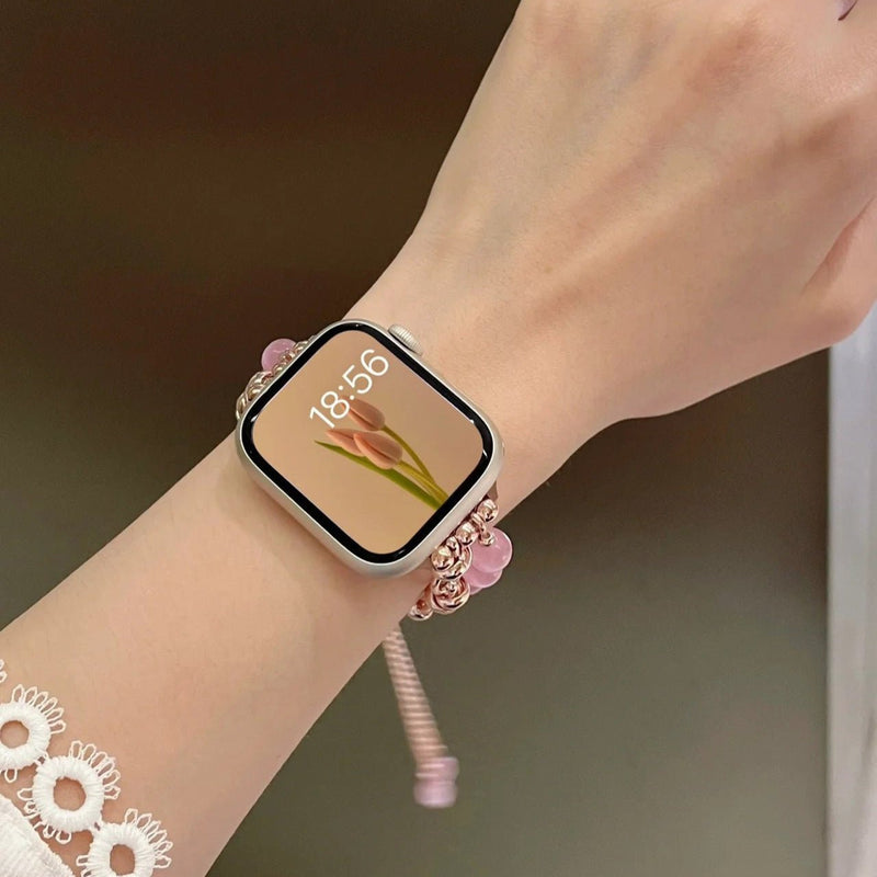 Bracelet pour Apple Watch en perles œil de chat roses et or rosé, style élégant et ajustable.
