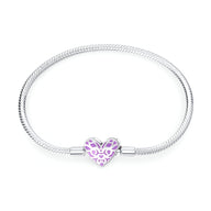 Bracelet serpent argent avec charm cœur lumineux violet ajouré pour femme.