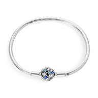 Bracelet argent 17 cm avec charm étoile et coquillage bleu et argenté.