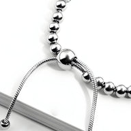 Bracelet femme en titane argenté avec perles rondes et détail coulissant lisse.