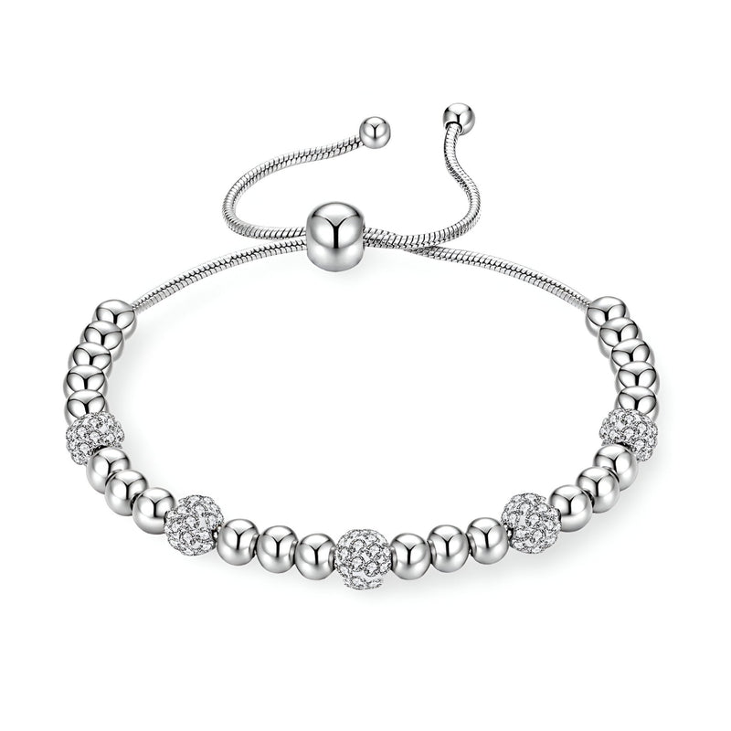 Bracelet pour femme en titane argenté avec perles lisses et boules pavées de zircones scintillantes.