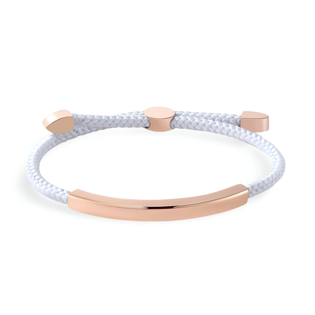 Bracelet femme cordon blanc avec détail barre et embouts en métal doré rose élégants.