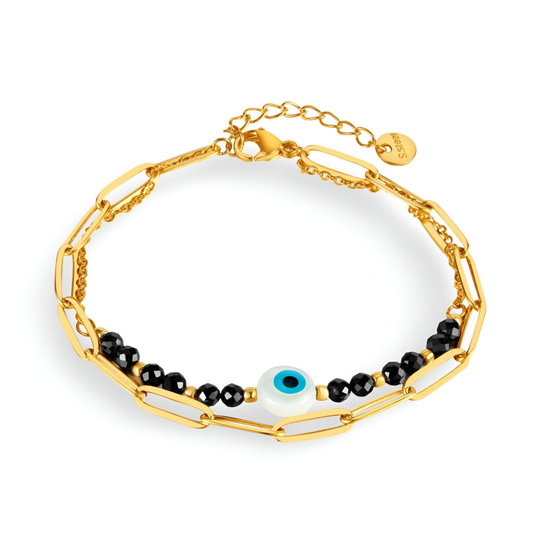 Bracelet pour femme en acier inoxydable doré avec perles noires et charm œil du diable bleu et blanc.