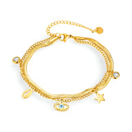 Bracelet femme en acier inoxydable doré avec charms oeil bleu et étoile, chaînes fines et breloques cristal.