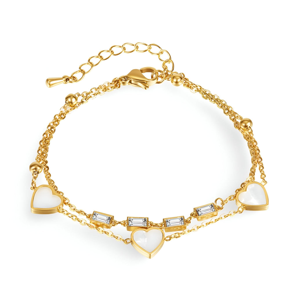 Bracelet femme en acier inoxydable doré avec cœurs et zirconiums rectangulaires scintillants.