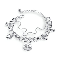 Bracelet femme en acier inoxydable argenté avec pendentifs cœur et arbre de vie, chaîne maille large.