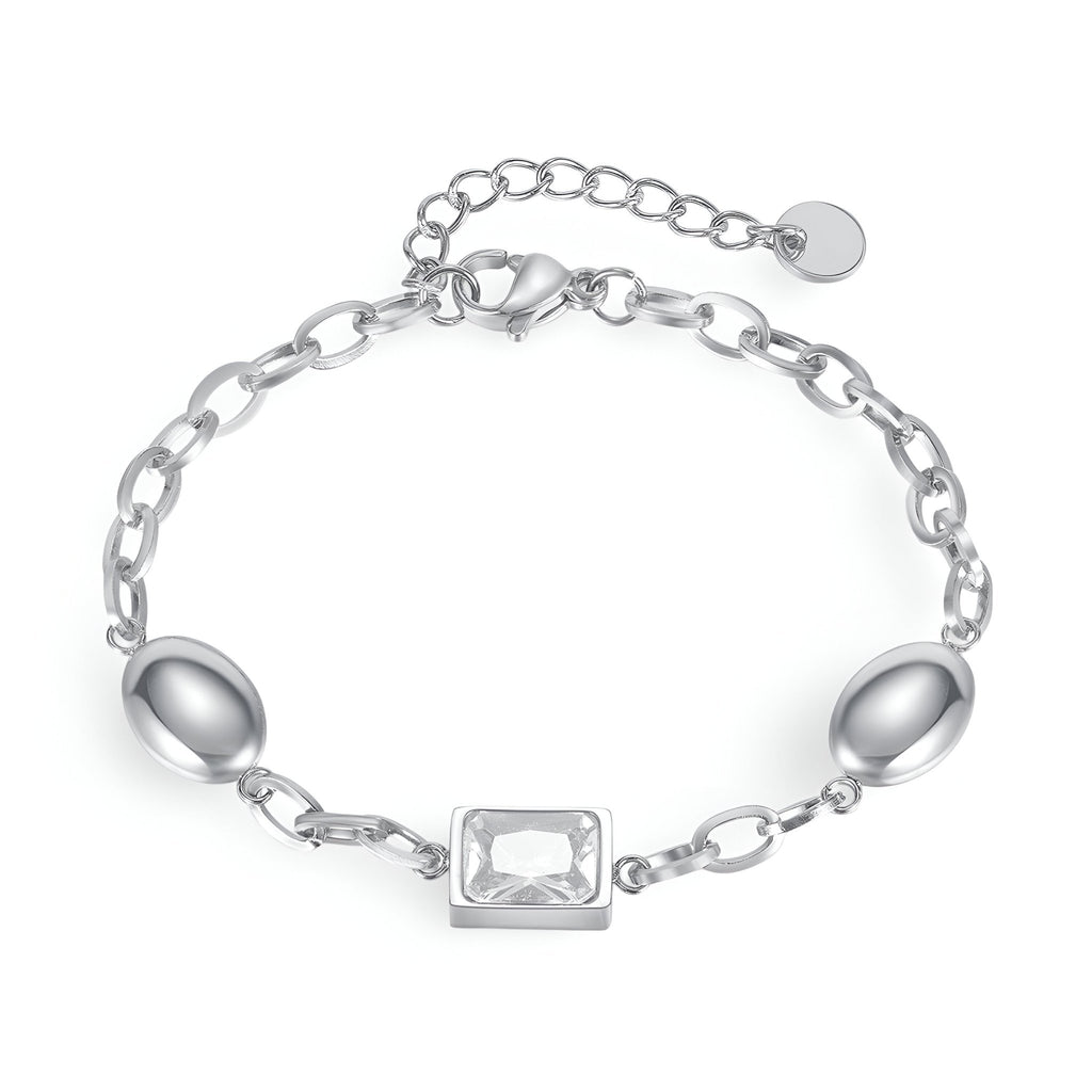 Bracelet femme en acier inoxydable argent avec cube de zirconium rectangulaire et maillons ovales.