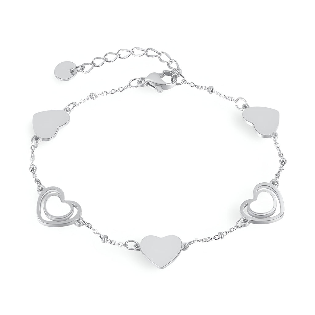 Bracelet femme en acier inoxydable argenté avec cœurs pleins et ajourés alternés, modèle Louisa.