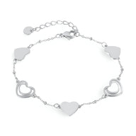 Bracelet femme en acier inoxydable argenté avec cœurs pleins et ajourés alternés, modèle Louisa.