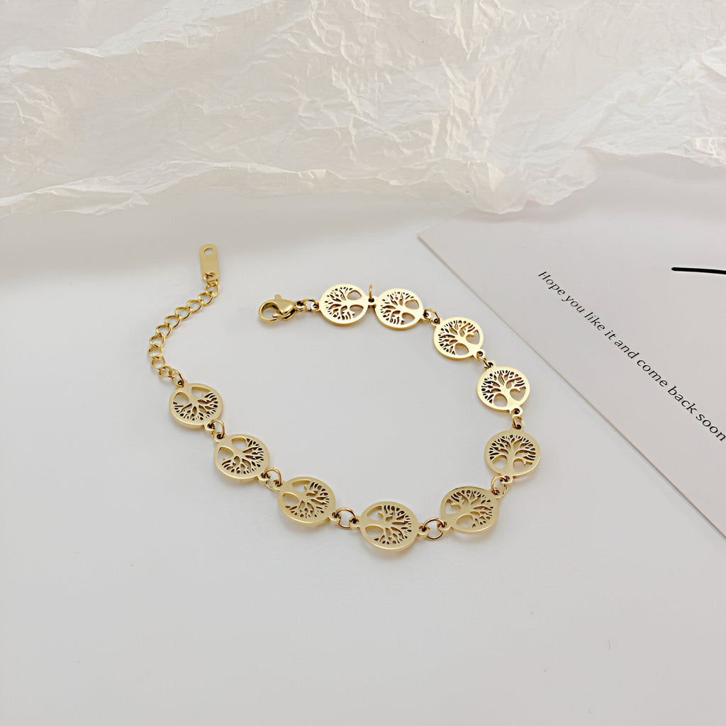 Bracelet femme or en acier inoxydable avec multiples pendentifs arbres de vie ajourés en cercles-linked.