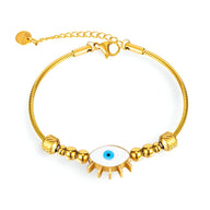 Bracelet femme en acier inoxydable doré avec pendentif œil bleu et petits anneaux décoratifs.