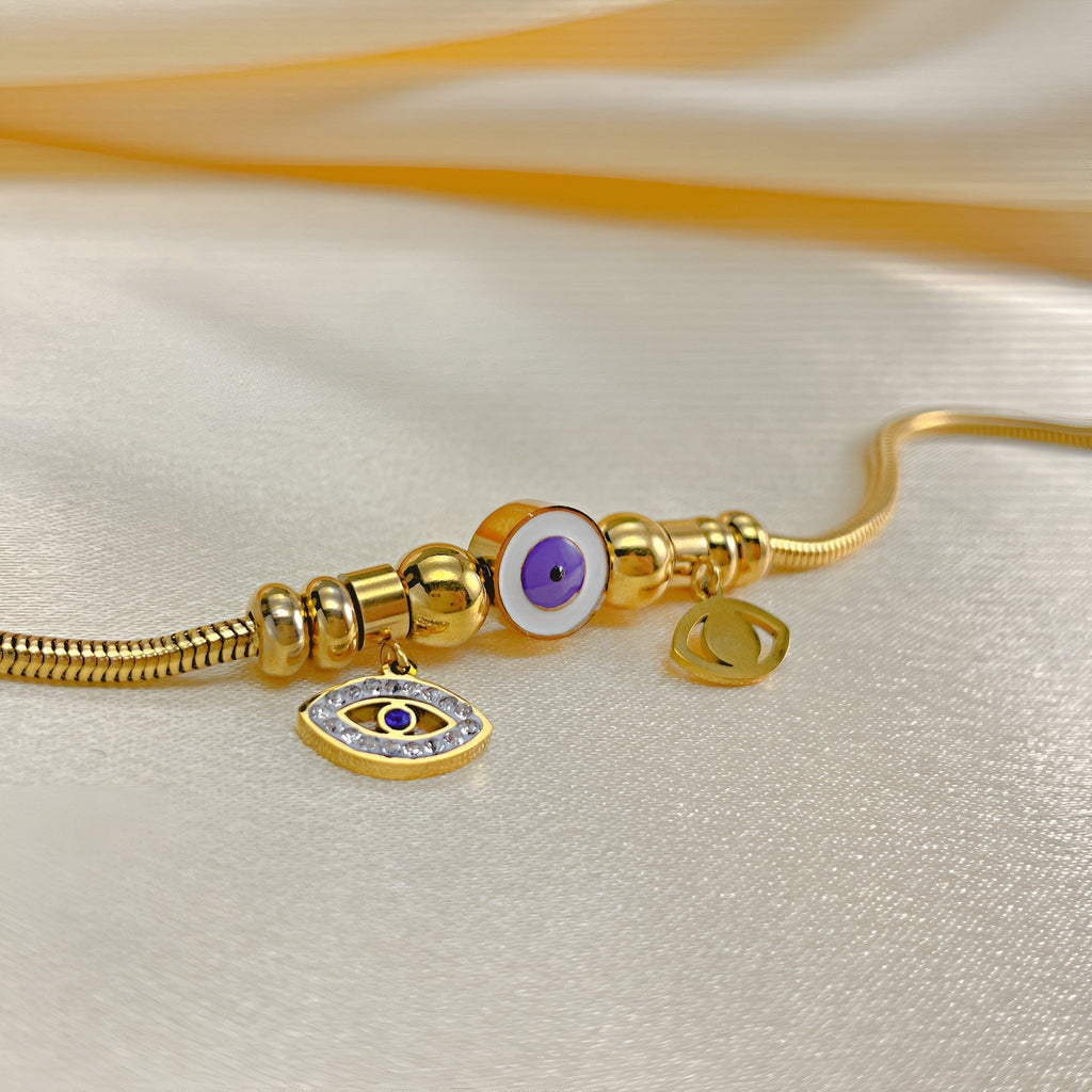 Bracelet or en acier inoxydable avec œil violet de protection et pendentif œil porte-bonheur.