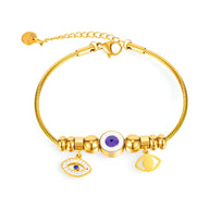 Bracelet femme en acier inoxydable doré avec pendentifs œil violet et charms protecteurs détaillés.
