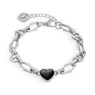 Bracelet en acier inoxydable argenté avec chaîne à maillons larges et cœur noir brillant au centre.