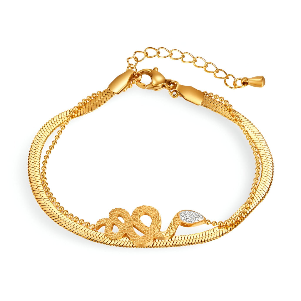 Bracelet femme en acier inoxydable doré avec motif serpent glissant orné de petits cristaux blancs.
