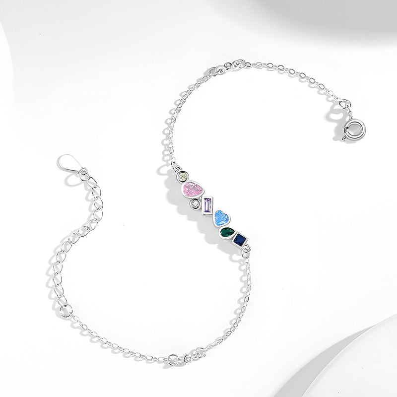 Bracelet femme en argent sterling avec pendentifs colorés en zircon de formes géométriques.