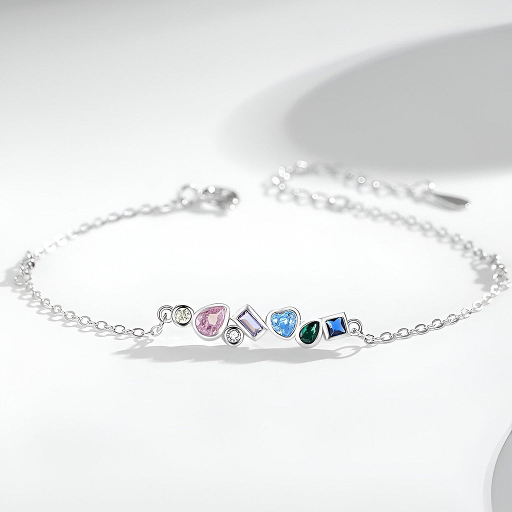 Bracelet femme en argent sterling avec cinq zircons colorés en forme de goutte et carré.