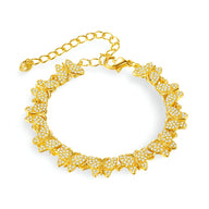 Bracelet en cuivre doré orné de multiples papillons sertis de zirconiums, modèle Alana.