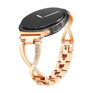 Bracelet métallique rose doré pour Samsung Watch 8 et Ultra avec boucle croisée ornée de zircons blancs.